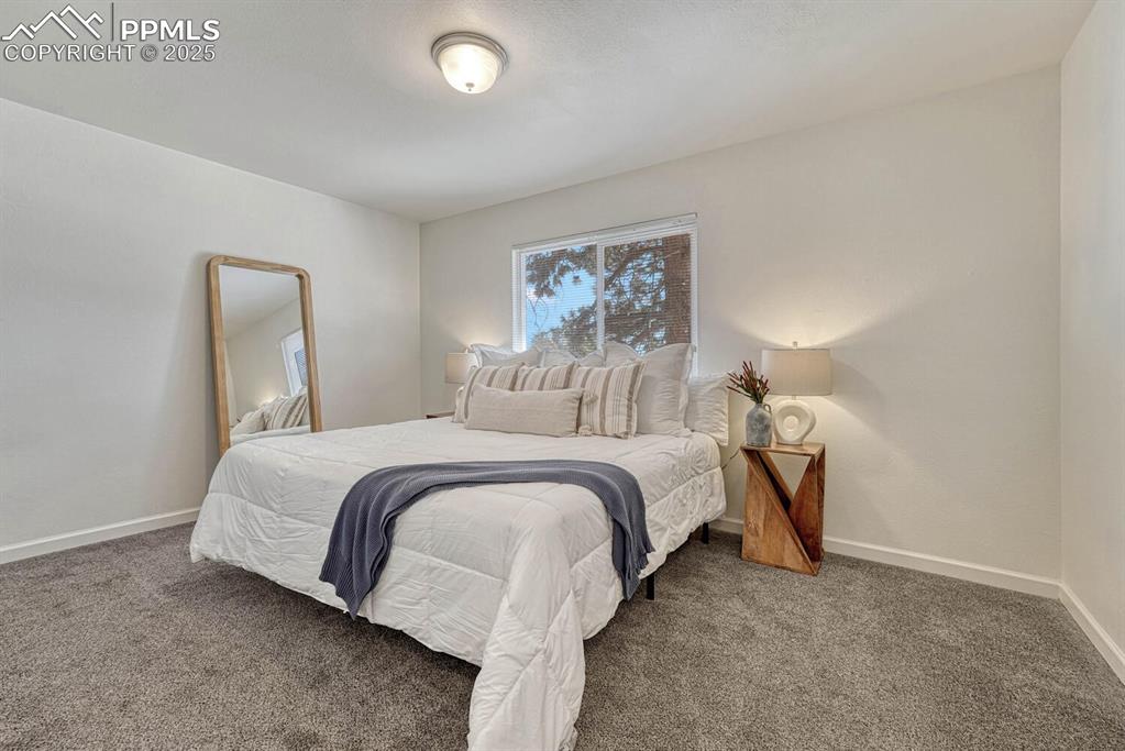 Image 17 of 43: Carpeted bedroom featuring baseboards