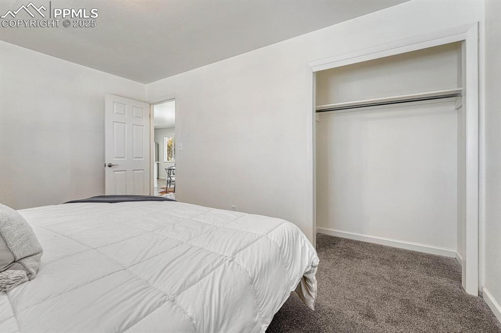 Image 19 of 43: Carpeted bedroom featuring baseboards and a closet