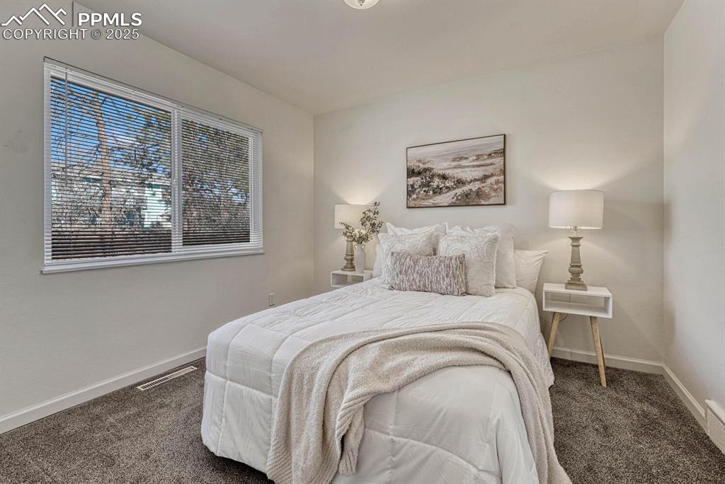 Image 21 of 43: Bedroom with carpet and baseboards