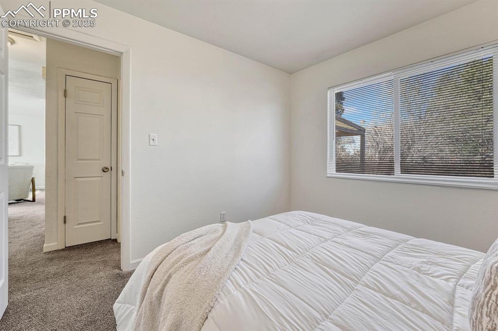 Image 23 of 43: Carpeted bedroom featuring baseboards