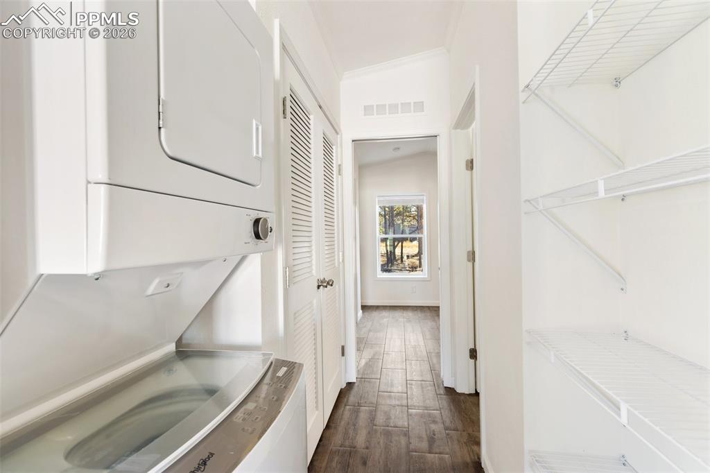 Image 12 of 15: Hallway and laundry.
