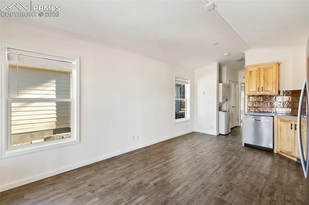 Image 3 of 15: Living room, kitchen and hallway/laundry. 