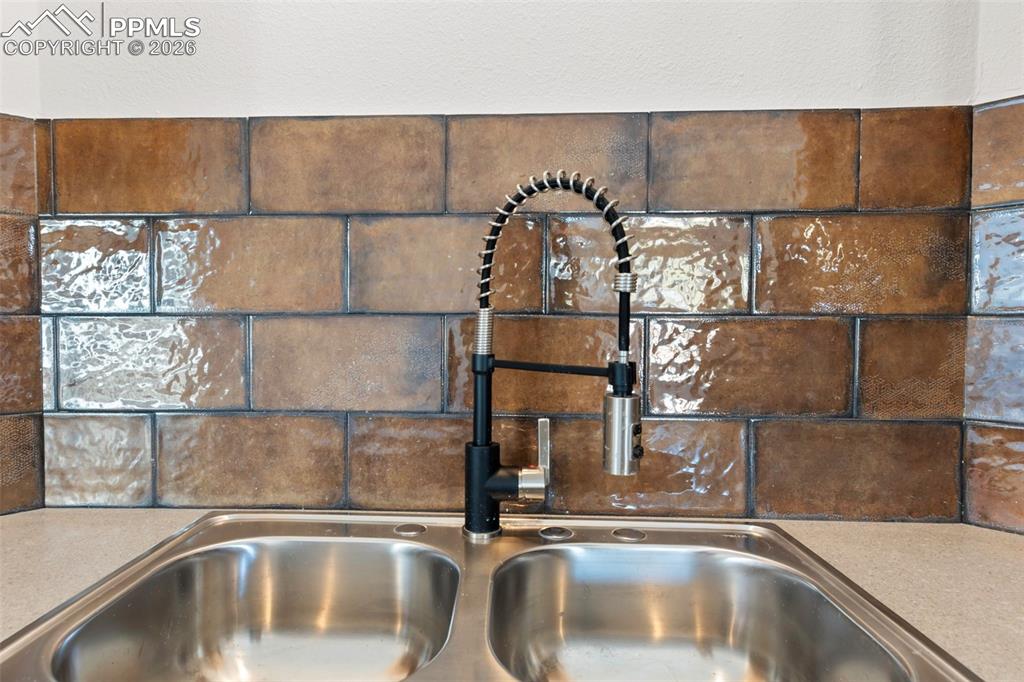 Image 6 of 15: Beautiful tile and sink.