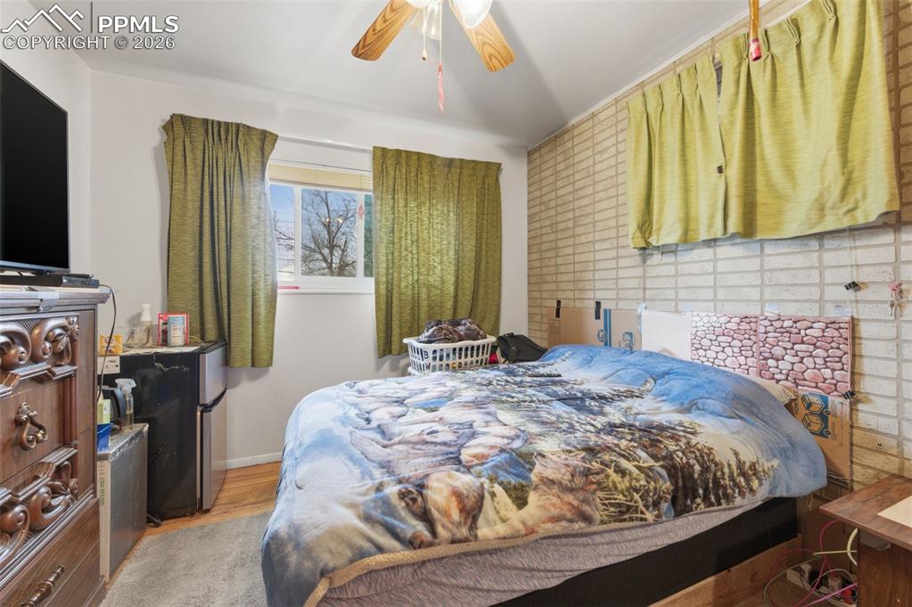 Image 16 of 24: Interior space with light-toned walls, a window, wood-finish flooring, and 
