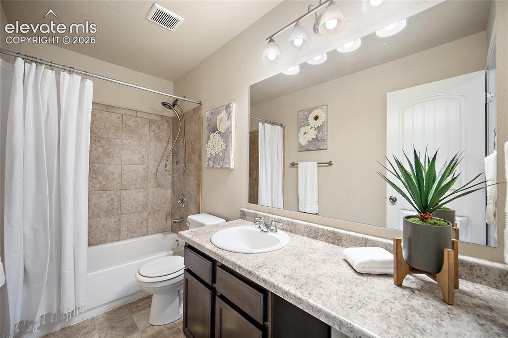 Image 24 of 38: Upstairs full bathroom 