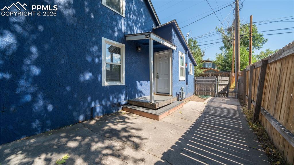 Image 11 of 14: Cottage house with off street parking and side entry into kitchen