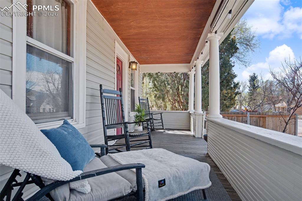 Image 3 of 14: Front covered porch sitting area