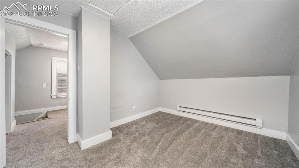 Image 9 of 14: Cottage upstairs bedroom
