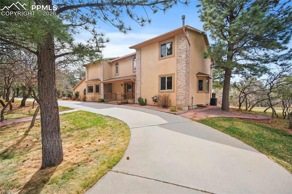 Image 1 of 49: Tucked away in the Woodmoor Oaks neighborhood, this stunning home boasts a