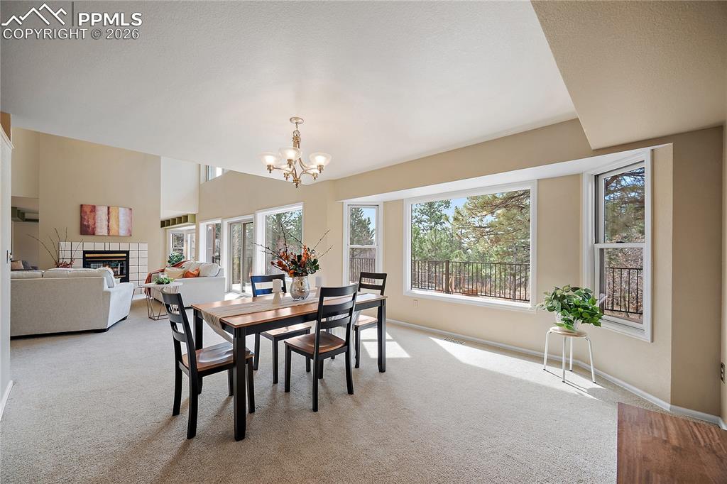 Image 13 of 49: Formal dining room, stunning views and bay window.