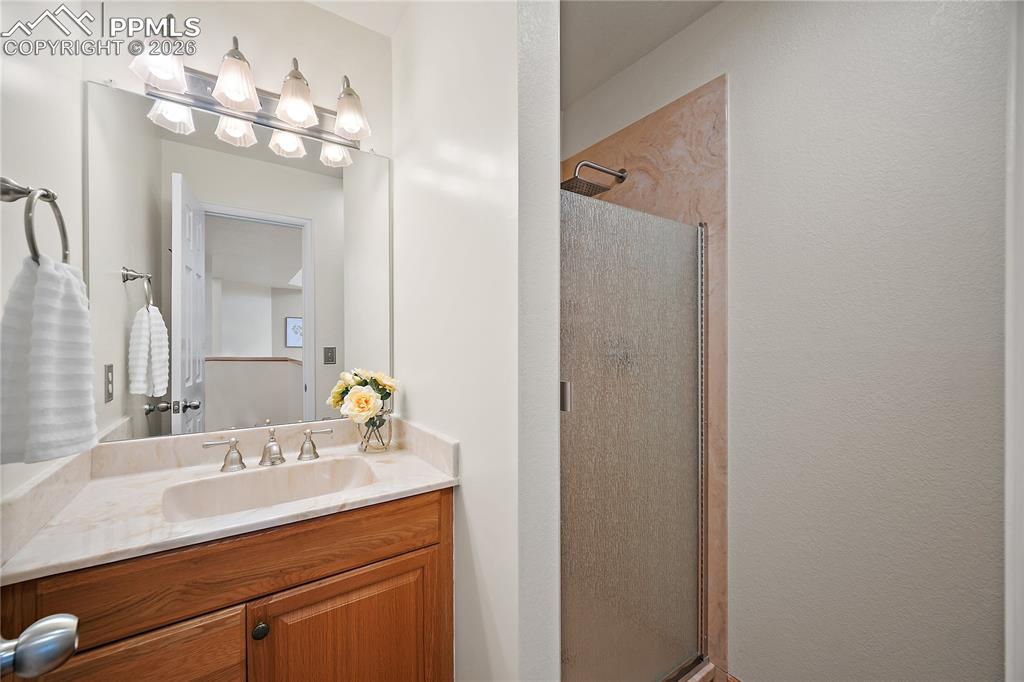 Image 21 of 49: Main level 3/4 bath.