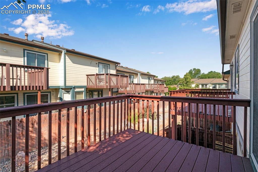 Image 16 of 30: Primary bedroom walk out View of wooden terrace