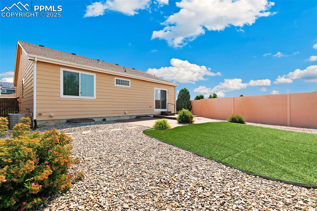 Image 28 of 28: Large, beautiful xeriscaped yard.