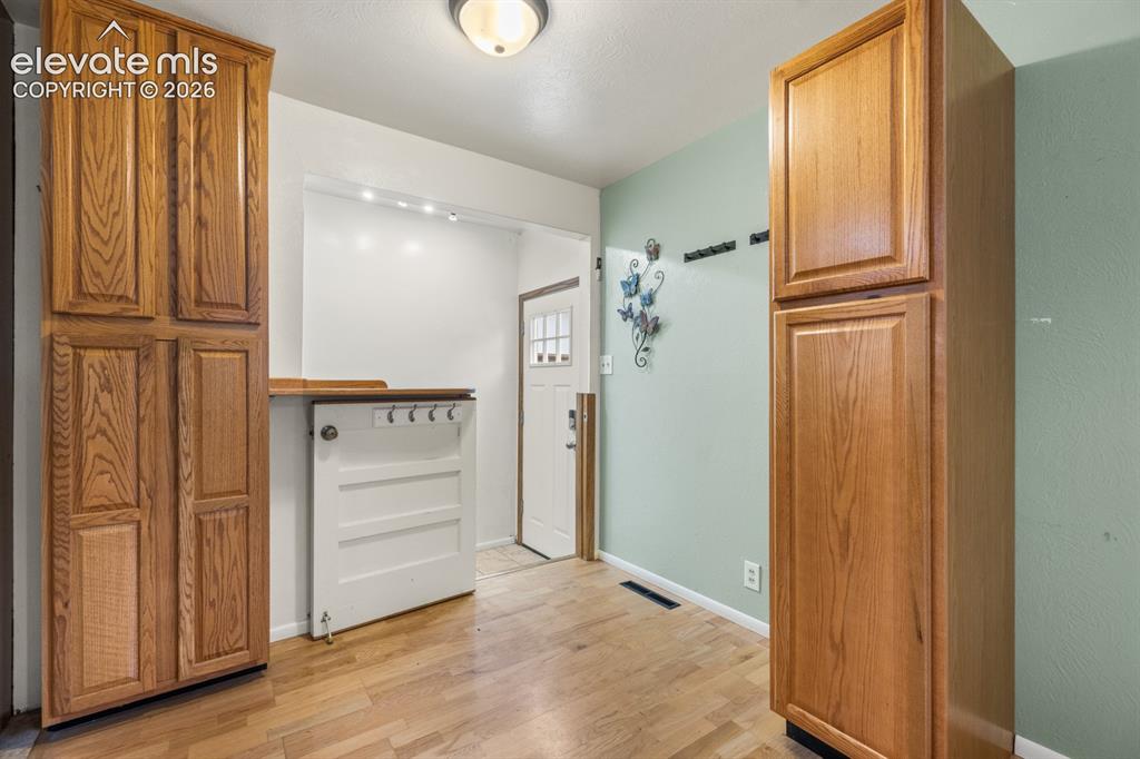 Image 12 of 32: Pantry cabinets in kitchen
