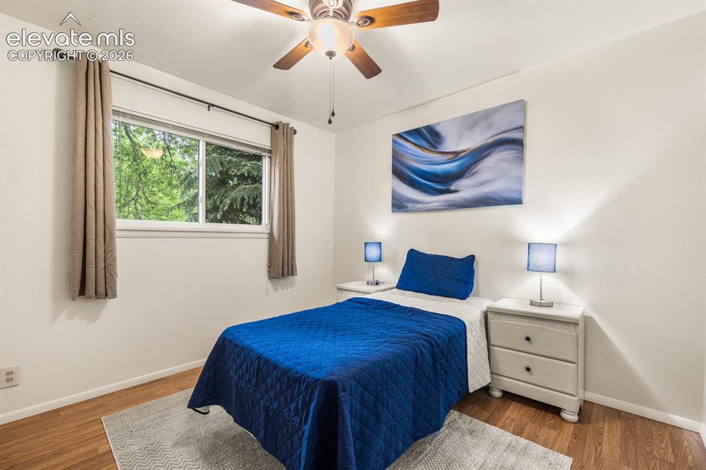 Image 15 of 32: Second Bedroom featuring wood-finish flooring and a ceiling fan
