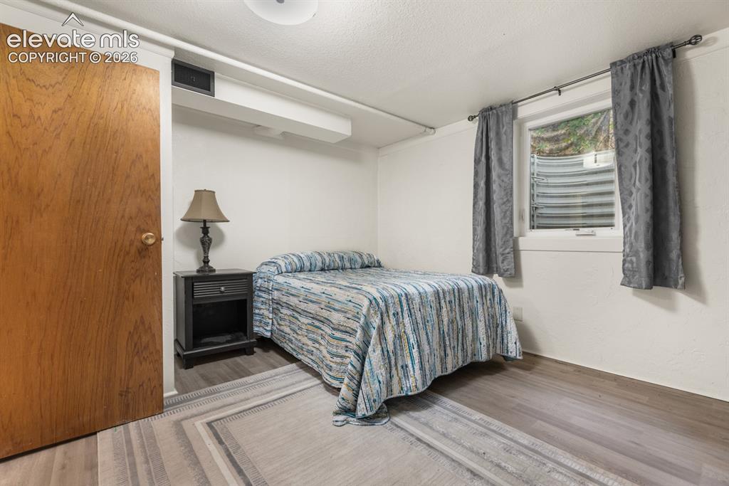 Image 20 of 32: Bedroom #3 is in the basement and includes an egress window and expanded wi