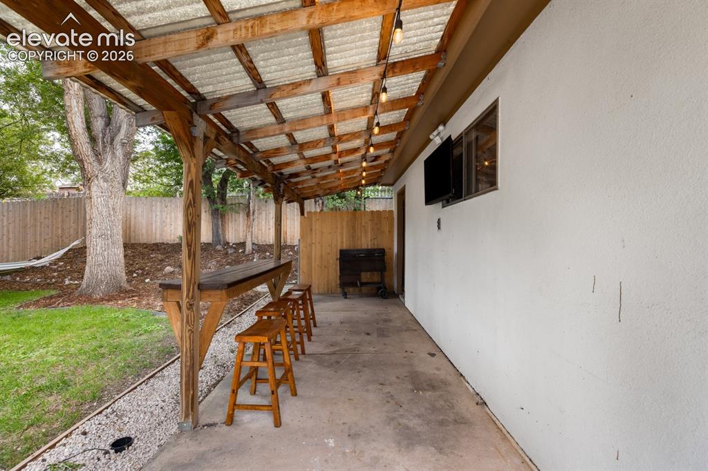 Image 29 of 32: Covered concrete patio