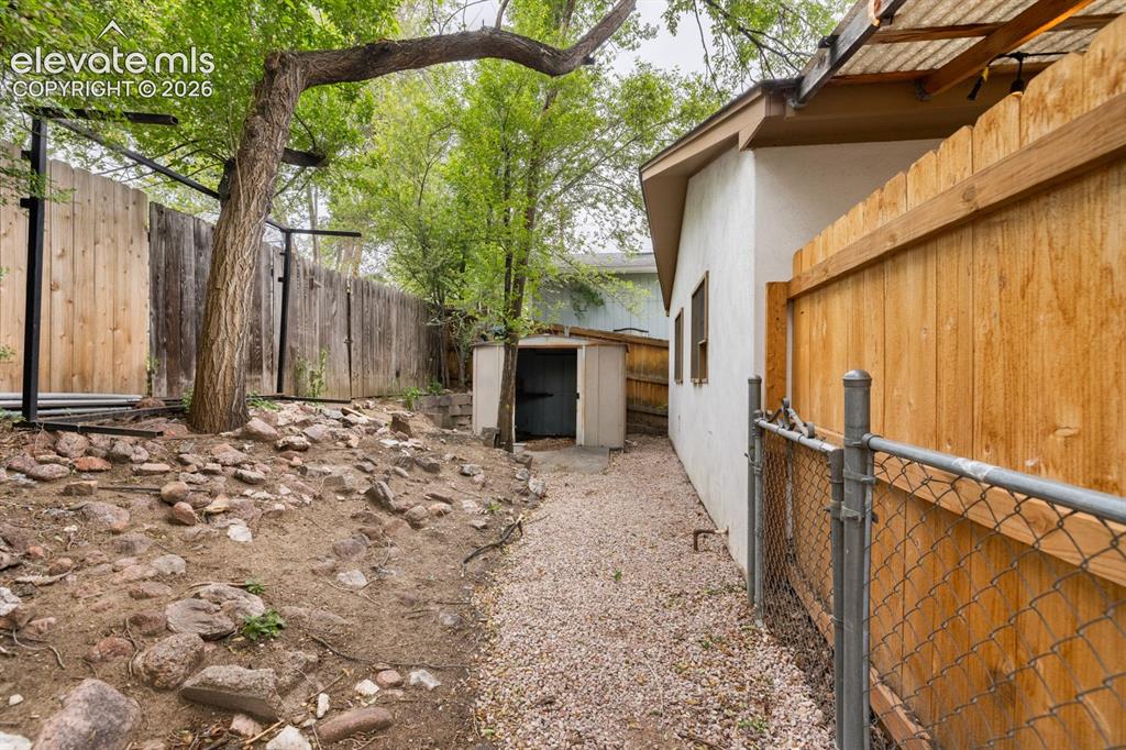 Image 31 of 32: Metal storage shed at back of the pro9perty.