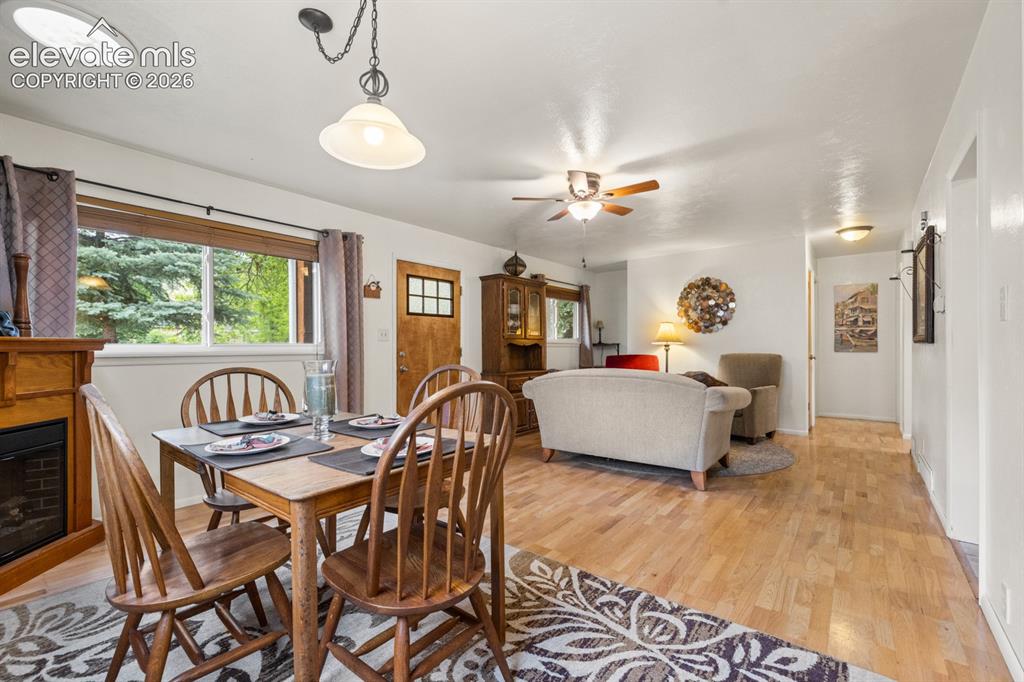 Image 8 of 32: Dining area featuring wood-finish flooring