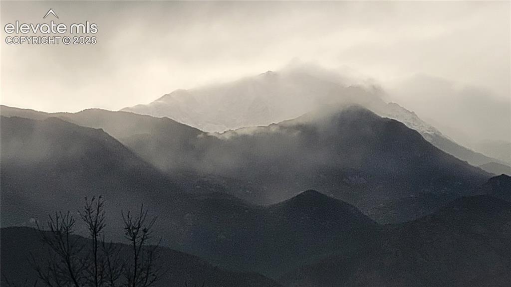 Image 27 of 28: A winter storm over Pikes Peak. This picture was taken off the deck