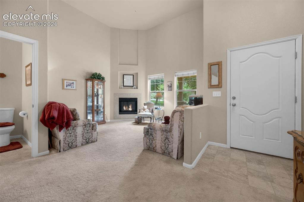 Image 3 of 28: Entry, Living room, and 1/2 bath