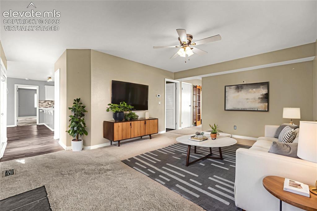 Image 14 of 49: Spacious Family Room featuring neutral wall tones, crown molding, and a cei