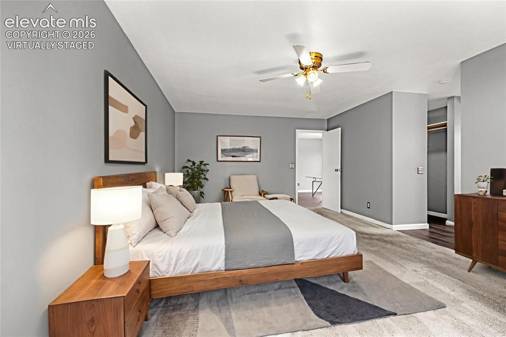 Image 16 of 49: Spacious sleeping area featuring light gray walls, white trim, and a ceilin
