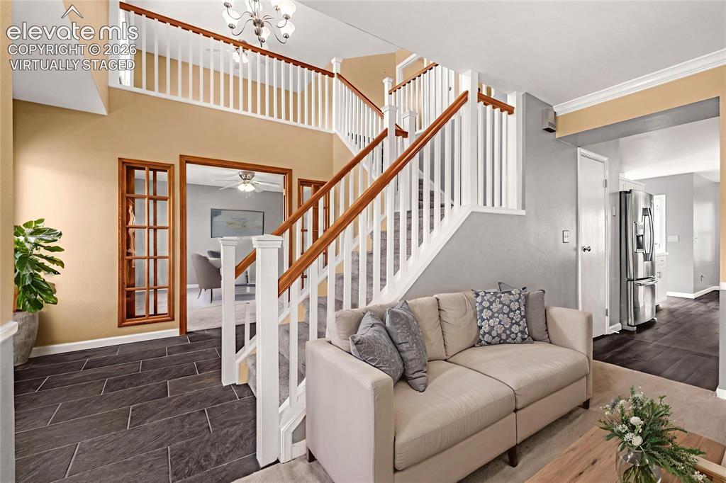 Image 9 of 49: Five-light chandelier, and large windows providing abundant natural light V