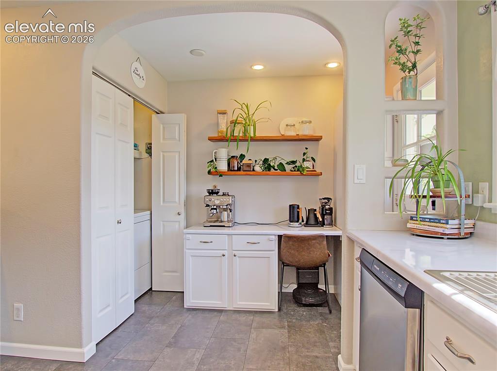 Image 10 of 25: Coffee bar, laundry area and access to back yard