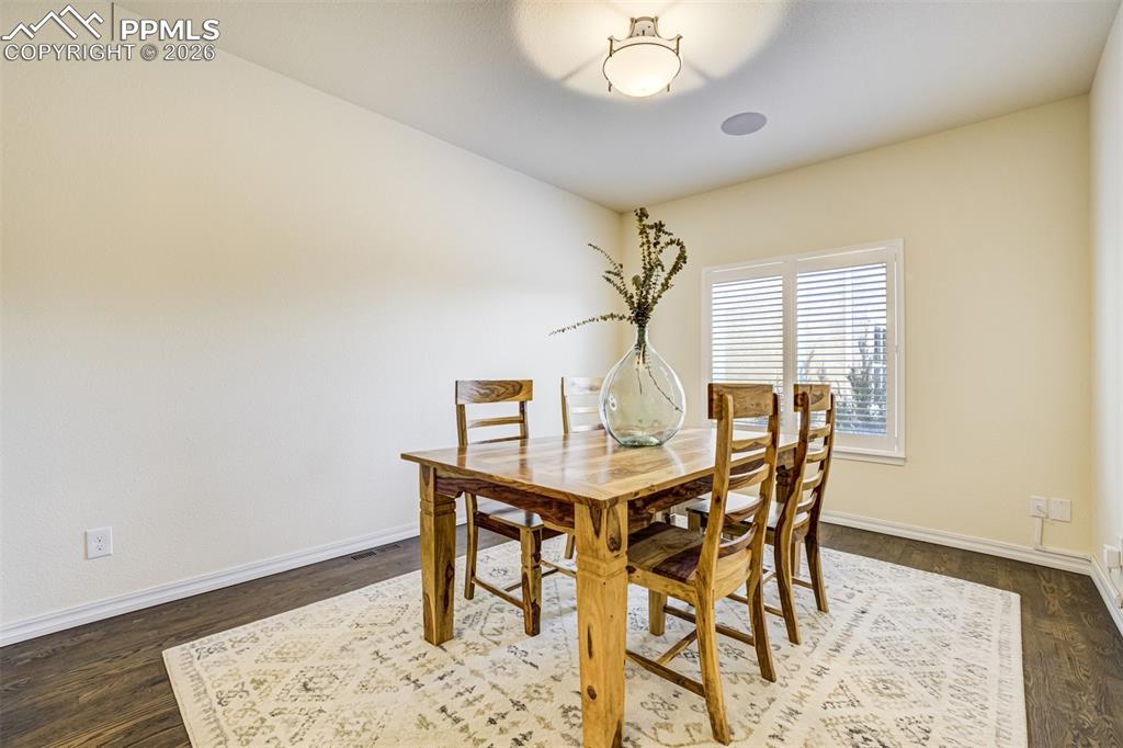 Image 17 of 50: Formal dining room for more private entertaining
