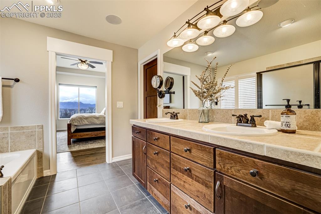 Image 24 of 50: Lots of natural light flows into the primary bathroom