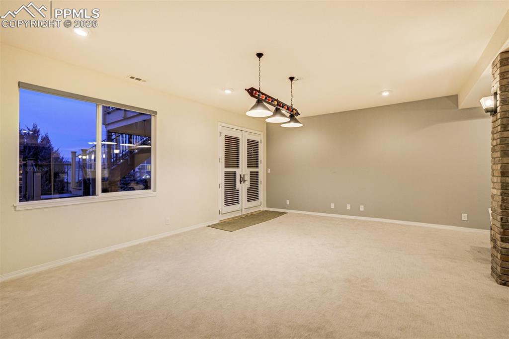 Image 27 of 50: The walk-out basement is large and open