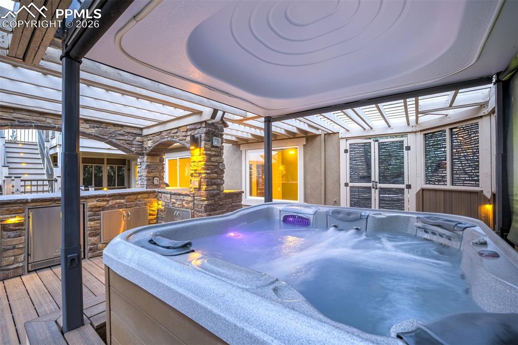 Image 43 of 50: Bullfrog Spa and electronic cover