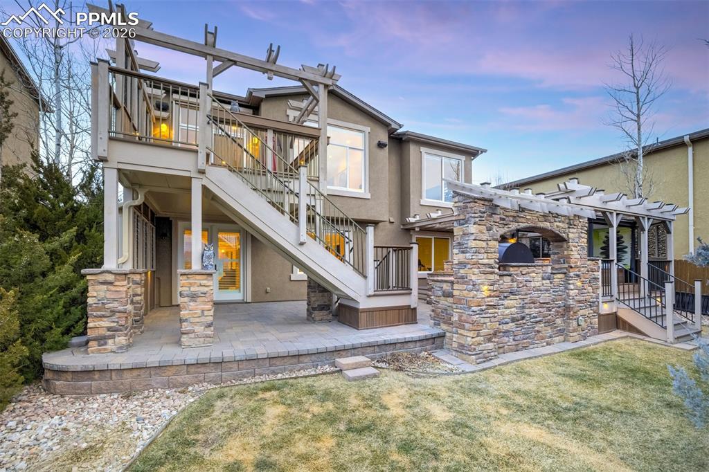 Image 48 of 50: Enjoy the sunsets from this beautiful deck and patio