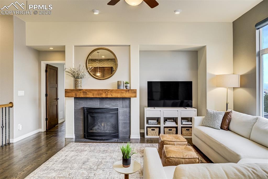 Image 5 of 50: A gas fireplace featuring a knotty alder mantle 