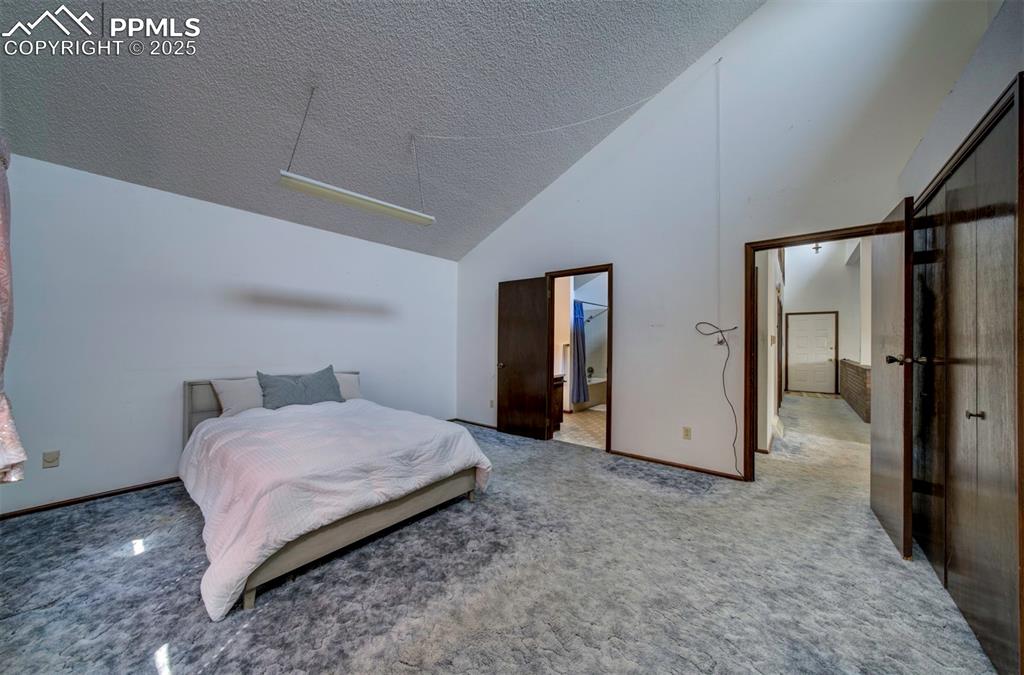 Image 27 of 50: Main level Primary Bedroom with adjoining Bathroom.