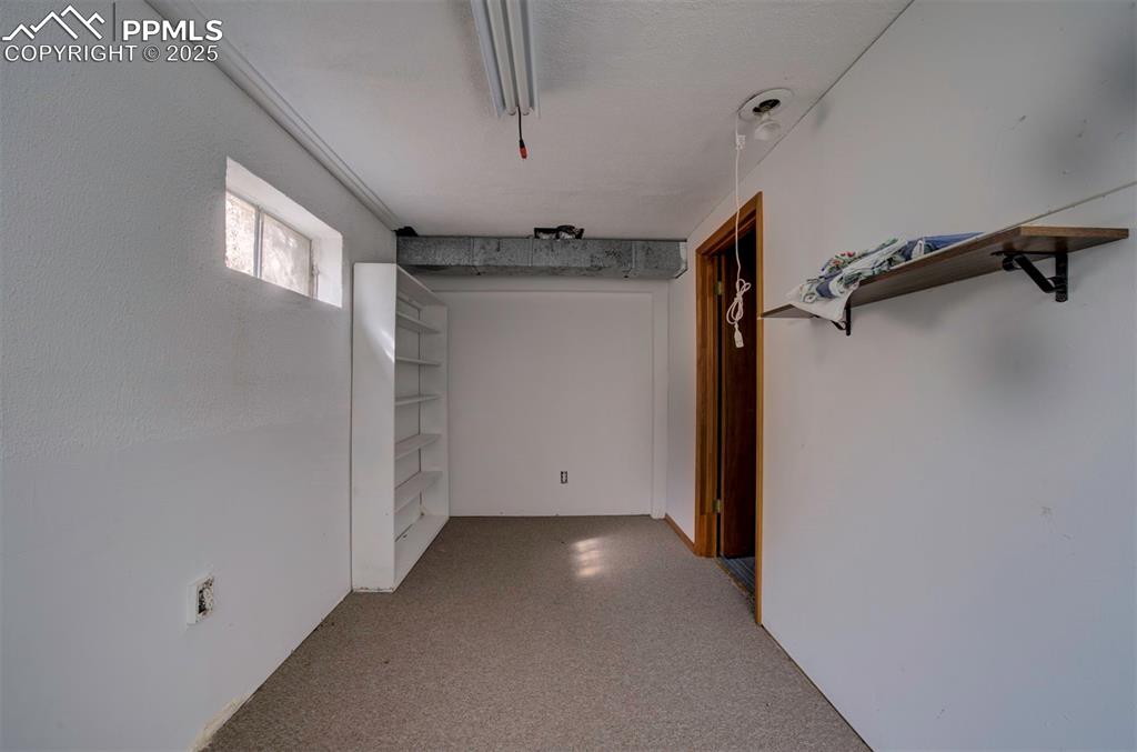 Image 37 of 50: One of two basement storage rooms.