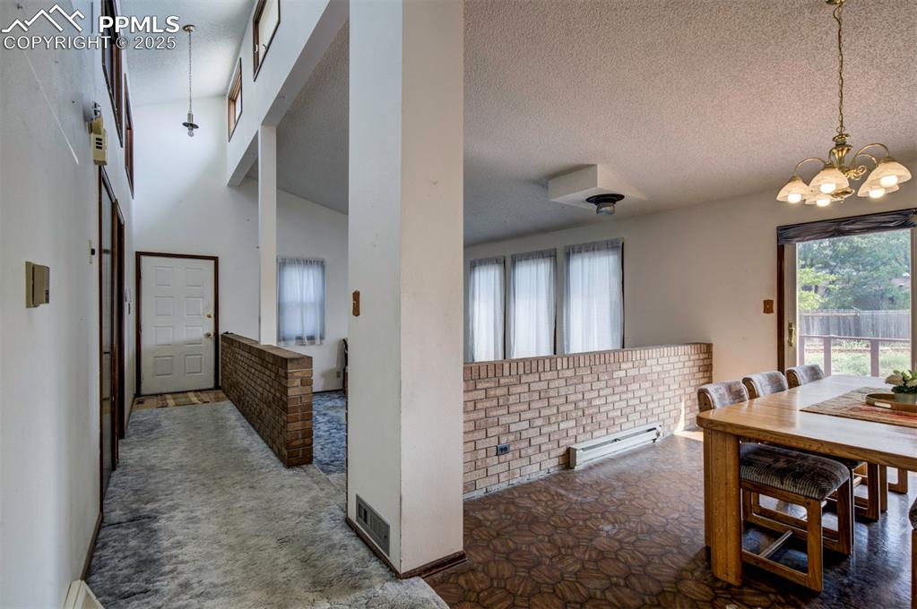 Image 4 of 50: Front Entrance into Living Room and Dining Area.