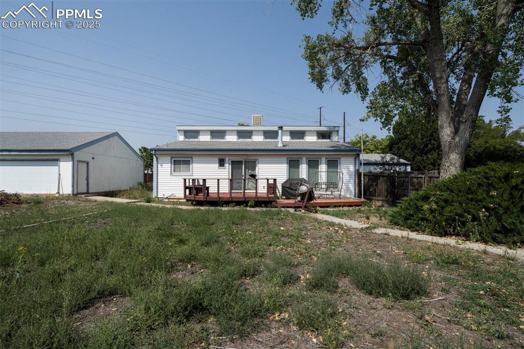 Image 40 of 50: Backyard deck for outdoor dining and relaxation.