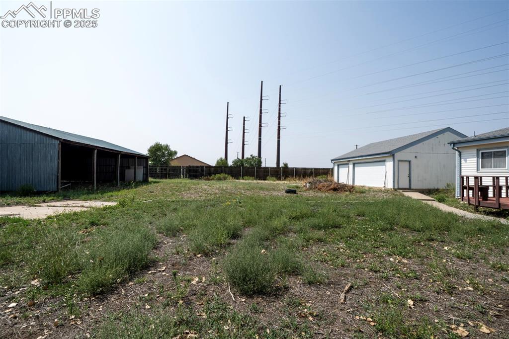 Image 44 of 50: 0.46-acre lot with pole barn and 3-car detached garage, pole barn, + additi