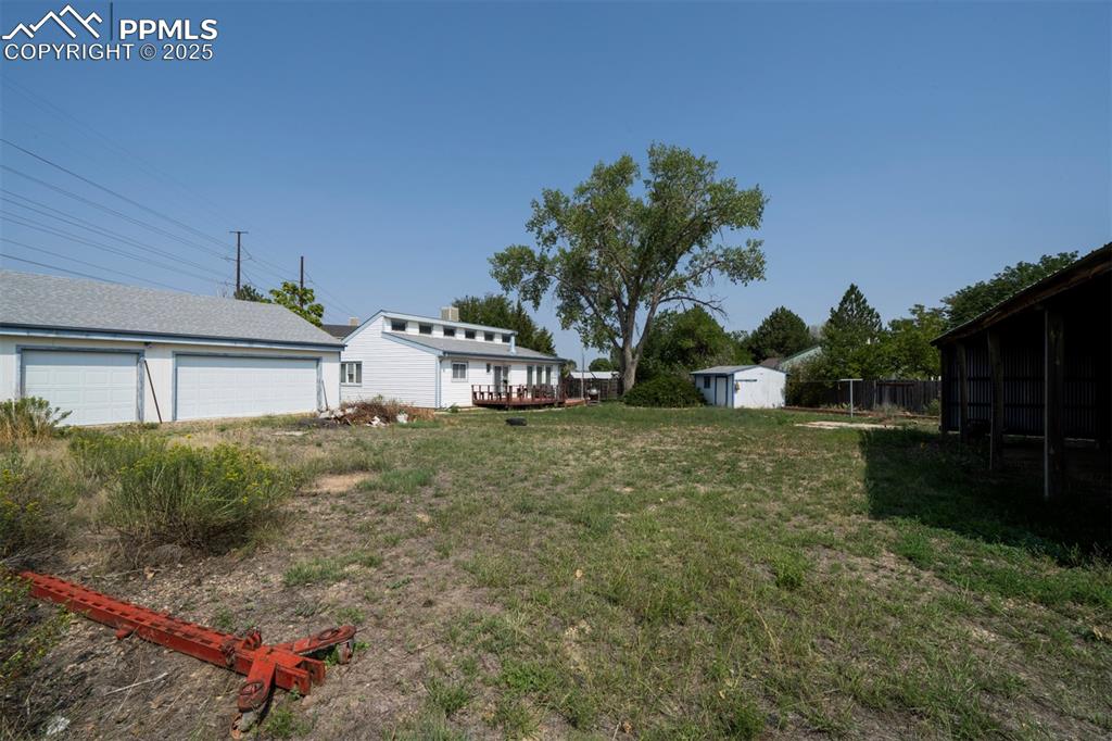 Image 46 of 50: o.46-acre fenced cul-de-sac lot with 3-car detached garage, pole barn, and 