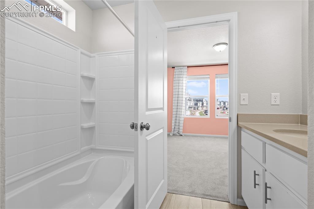 Image 21 of 26: Full bath featuring bathtub / shower combination, a wealth of natural light