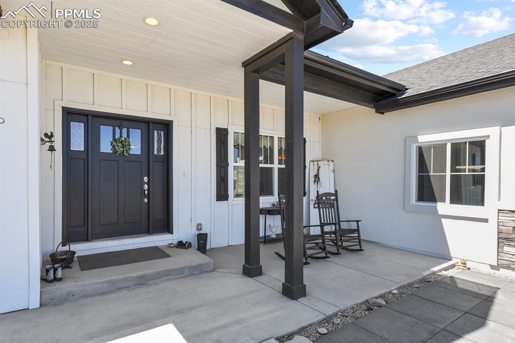 Image 6 of 50: Relaxing front porch