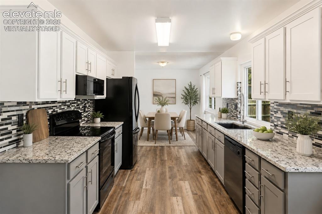 Image 6 of 32: The Kitchen features granite counter tops and includes all appliances. virt