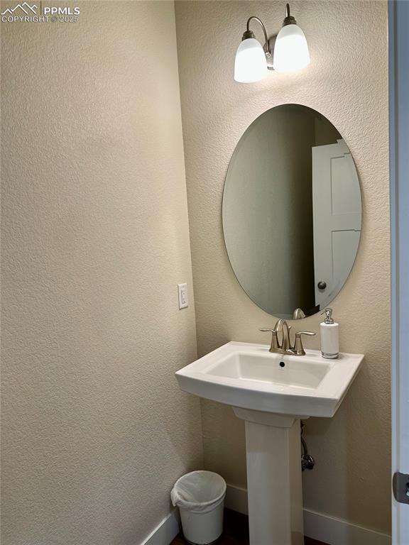 Image 28 of 38: Bathroom with a textured wall