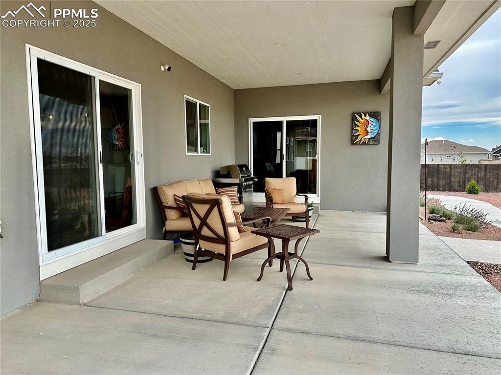 Image 30 of 38: View of patio with outdoor lounge area