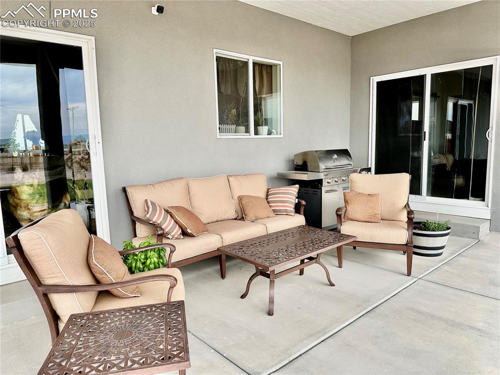 Image 31 of 38: View of patio / terrace featuring outdoor lounge area and exterior kitchen