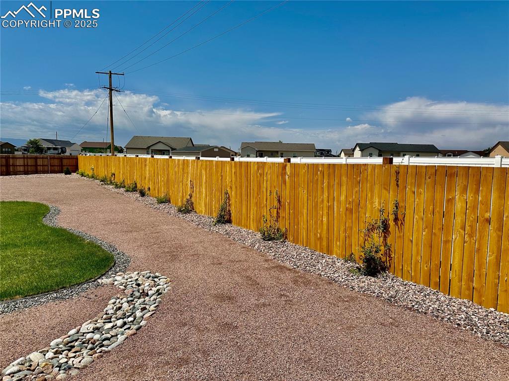 Image 36 of 38: View of yard featuring a residential view