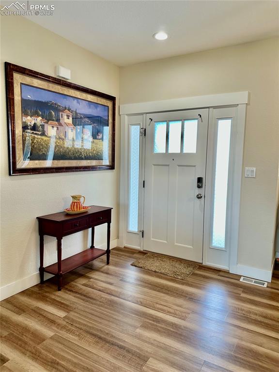 Image 4 of 38: Entryway featuring light wood-style flooring and recessed lighting