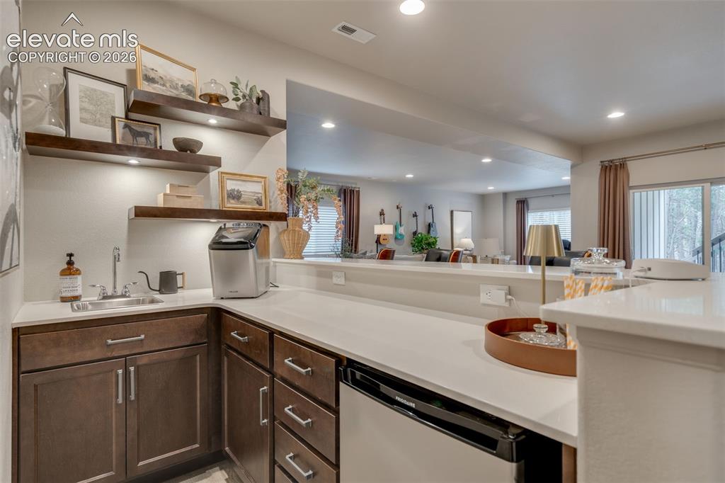 Image 34 of 48: Basement wet bar